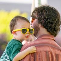 Father holding little boy